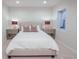 Bedroom featuring lamps, end tables, and a window with light at 2320 N Lafayette St, Denver, CO 80205