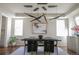 Dining room featuring modern lighting fixture above a large table, chairs, and artwork at 2320 N Lafayette St, Denver, CO 80205