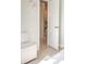 Hallway showing hardwood floors, white doors, and trim leading towards stairs at 2320 N Lafayette St, Denver, CO 80205
