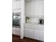 Stylish kitchen with stainless steel appliances, subway tile backsplash, and ample cabinet space at 2320 N Lafayette St, Denver, CO 80205