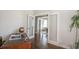 Open home office with glass french doors, globe, and wood floors at 2320 N Lafayette St, Denver, CO 80205