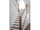 Elegant staircase with wooden handrails and white risers to the upper level of the home at 2320 N Lafayette St, Denver, CO 80205