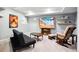 Finished basement recreation room with comfortable seating and large TV at 9790 Moss Rose Cir, Highlands Ranch, CO 80129