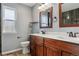 Bathroom with double vanity and updated fixtures at 9790 Moss Rose Cir, Highlands Ranch, CO 80129