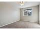 Spacious bedroom with grey carpet and ceiling fan at 9790 Moss Rose Cir, Highlands Ranch, CO 80129