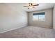 Spacious bedroom with grey carpet and ceiling fan at 9790 Moss Rose Cir, Highlands Ranch, CO 80129