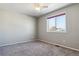 Spacious bedroom with grey carpet and ceiling fan at 9790 Moss Rose Cir, Highlands Ranch, CO 80129