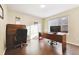 Bright home office with hardwood floors and built-in desk at 9790 Moss Rose Cir, Highlands Ranch, CO 80129