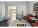 Open and bright living room with hardwood floors, staircase, and comfortable seating at 9790 Moss Rose Cir, Highlands Ranch, CO 80129