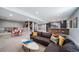 Spacious finished basement featuring a living area, game table, and bar for entertaining at 2732 S Jackson St, Denver, CO 80210