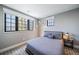 Cozy bedroom featuring a comfortable bed, ample natural light from large windows at 2732 S Jackson St, Denver, CO 80210