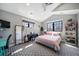 Well-lit bedroom with a bed, piano, and stylish decor at 2732 S Jackson St, Denver, CO 80210