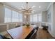 Elegant dining room featuring a modern chandelier, wainscoting, and large windows at 2732 S Jackson St, Denver, CO 80210