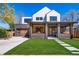 Stunning two-story home with a brick and siding facade, a covered porch, and manicured front lawn, showcasing curb appeal at 2732 S Jackson St, Denver, CO 80210