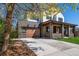 Stunning two-story home featuring a modern design, brick accents, covered porch, and a spacious three-car garage at 2732 S Jackson St, Denver, CO 80210