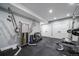 Well-equipped home gym with modern exercise machines, rubber floor, and ample space for a complete fitness routine at 2732 S Jackson St, Denver, CO 80210