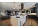 Bright, modern kitchen with a spacious island, stylish cabinetry, and an open layout to the living room at 2732 S Jackson St, Denver, CO 80210