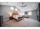 Spacious main bedroom with vaulted ceiling, modern fan, and neutral color palette at 2732 S Jackson St, Denver, CO 80210