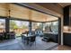 Spacious patio with hot tub, outdoor seating, grill, and a partially covered area for entertaining at 2732 S Jackson St, Denver, CO 80210