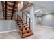 Modern staircase with open treads and sleek black railings, enhancing the home's contemporary design at 2732 S Jackson St, Denver, CO 80210