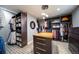 Custom walk-in closet featuring ample shelving, drawers, and center island for storage at 2732 S Jackson St, Denver, CO 80210