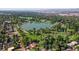 Aerial view of a park with a lake surrounded by trees at 1050 S Gilpin St, Denver, CO 80209