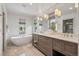 Luxurious bathroom with soaking tub, dual vanity, and marble countertops at 1050 S Gilpin St, Denver, CO 80209