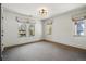 Bedroom with plush carpet, large windows, and custom window treatments at 1050 S Gilpin St, Denver, CO 80209
