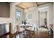 Cozy breakfast nook with bench seating, a marble table, and a view of the kitchen at 1050 S Gilpin St, Denver, CO 80209