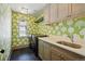 Laundry room featuring patterned wallpaper, tile floor, and modern washer and dryer at 1050 S Gilpin St, Denver, CO 80209