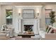 Living room with fireplace, mantle and recessed lights at 1050 S Gilpin St, Denver, CO 80209