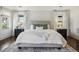 Spacious bedroom with neutral tones, a comfortable bed, and matching nightstands at 1050 S Gilpin St, Denver, CO 80209