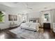 Bright bedroom with ceiling fan, large bed, and stylish rug at 1050 S Gilpin St, Denver, CO 80209