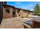 Brick patio with stone pavers, outdoor seating, and a grilling area at 1050 S Gilpin St, Denver, CO 80209