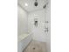 Elegant shower with bench seating, dual shower heads, and neutral color palette at 1050 S Gilpin St, Denver, CO 80209