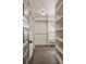 Organized walk-in closet featuring custom shelving, drawers, and ample storage space at 1050 S Gilpin St, Denver, CO 80209