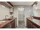 Wet bar area with custom cabinetry, adjacent wine cellar, and decorative lighting at 1050 S Gilpin St, Denver, CO 80209