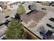 A bird's-eye view of the two-story brick apartment complex, surrounded by mature trees and parking spaces at 2241 Dexter Dr # 2, Longmont, CO 80501