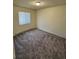 Comfortable bedroom with plush carpet, a window bringing in natural light, and neutral wall color at 2241 Dexter Dr # 2, Longmont, CO 80501