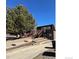 Exterior of home with brick facade and stairs leading to upper unit at 2241 Dexter Dr # 2, Longmont, CO 80501