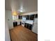 An updated kitchen with stainless steel appliances, modern flooring, and plenty of storage space at 2241 Dexter Dr # 2, Longmont, CO 80501