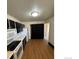 A bright kitchen featuring modern flooring, updated appliances, and plenty of cabinet space at 2241 Dexter Dr # 2, Longmont, CO 80501
