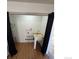 Well-lit laundry room featuring a utility sink and modern flooring at 2241 Dexter Dr # 2, Longmont, CO 80501