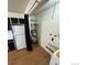 A clean laundry room with modern flooring, and space for the appliances at 2241 Dexter Dr # 2, Longmont, CO 80501