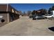 Parking lot in front of property, with a brick facade at 2241 Dexter Dr # 2, Longmont, CO 80501