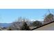 Scenic view of snow-capped mountains behind tree line at 2241 Dexter Dr # 2, Longmont, CO 80501