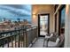 Balcony at night with city views, complete with seating at 1643 Boulder St # 211, Denver, CO 80211