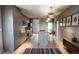 Modern kitchen with stainless steel appliances, lots of cabinets, a large island, and stylish pendant lighting at 1643 Boulder St # 211, Denver, CO 80211