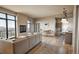 Spacious living room with large windows, a fireplace, and an open layout with dining area and kitchen at 1643 Boulder St # 211, Denver, CO 80211
