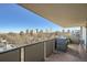 Private balcony with a cityscape view, offering outdoor space with a sleek metal railing and mature trees at 1085 N Lafayette St # 804, Denver, CO 80218